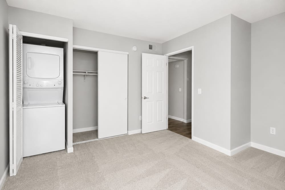 Laundry area with washer and storage at The Everette in Rocklin, California