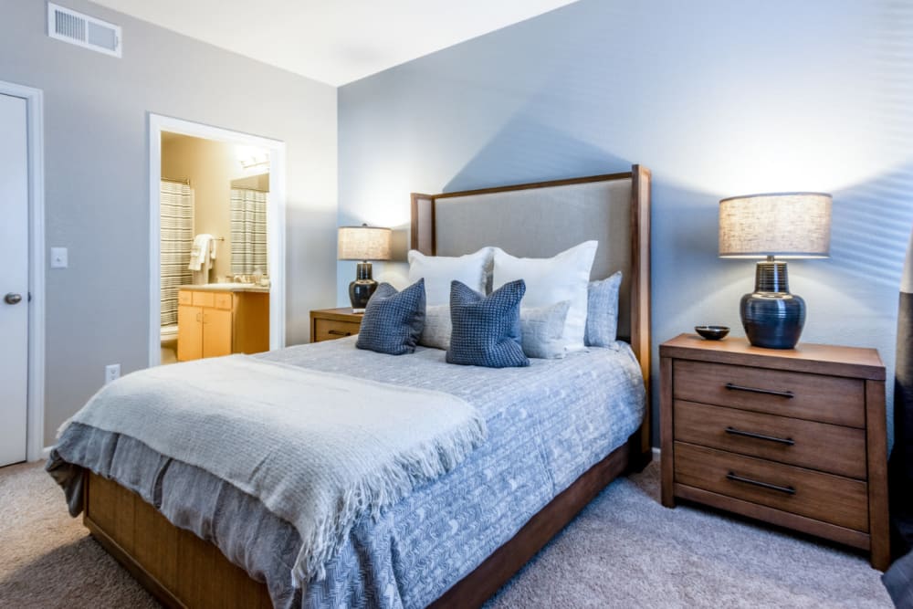 Master bedroom with plush carpeting at The Links at Plum Creek in Castle Rock, Colorado