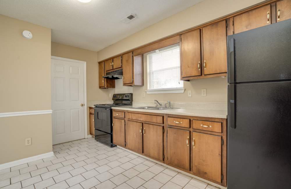 Kitchen with refrigerator at Spring Hill Apartments in Ringgold, Georgia