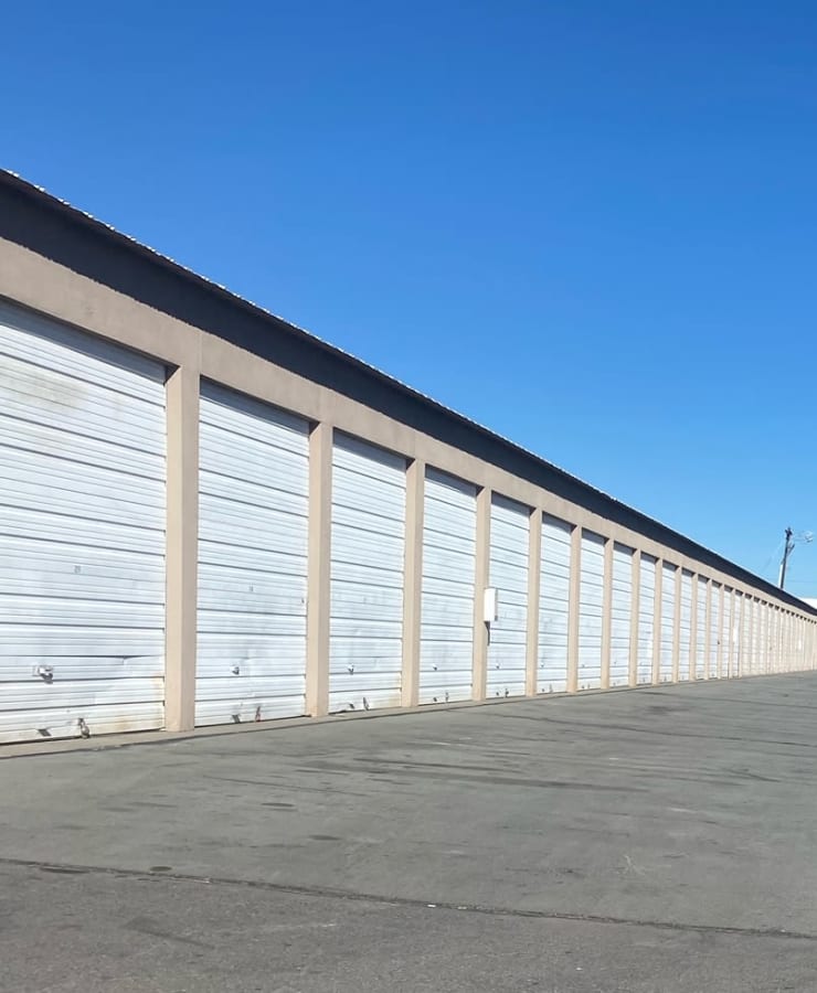 A row of outdoor units, with red doors closed, at Security Storage in Sparks, Nevada