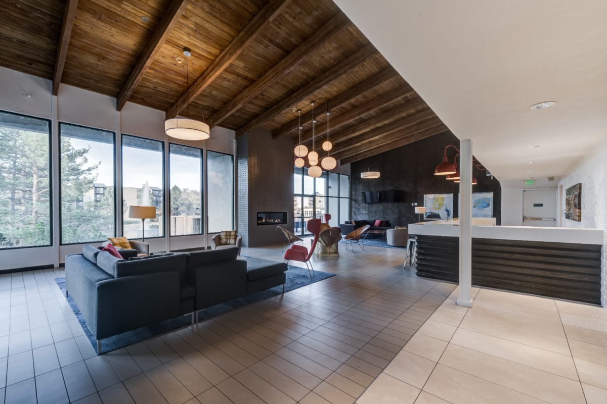Community clubhouse with lounge area and fireplace at Ashford Belmar in Lakewood, Colorado