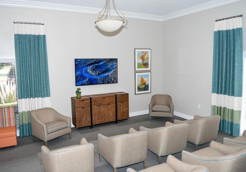 TV area with seating for residents in the clubhouse at The Villas at Rowland Heights in Rowland Heights, California