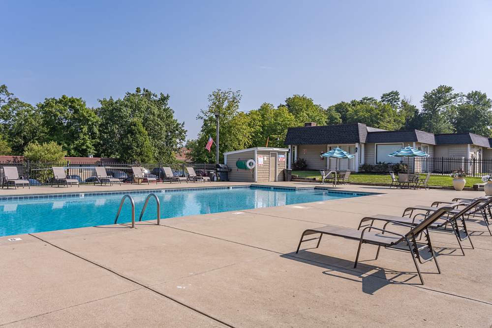 Swimming pool with lounge beds at Millcroft Apartments & Townhomes in Milford, Ohio