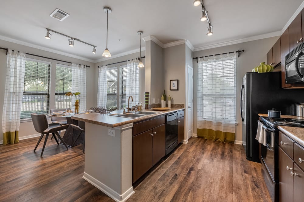 Bright kitchen and dining area at Marquis at Sugar Land in Sugar Land, Texas
