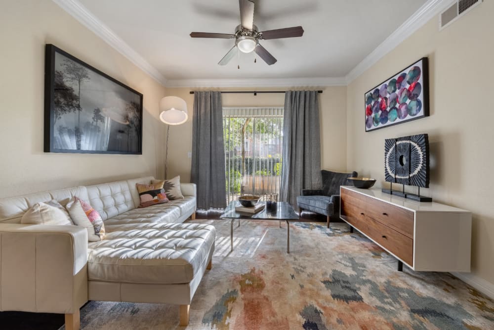 Modern and sleek living room with large rug at Marquis at Kingwood in Kingwood, Texas