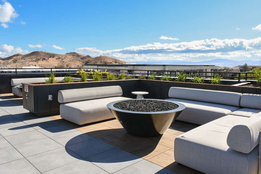 Aerial view of pool and green spaces at Stone Village Apartments in Reno, Nevada