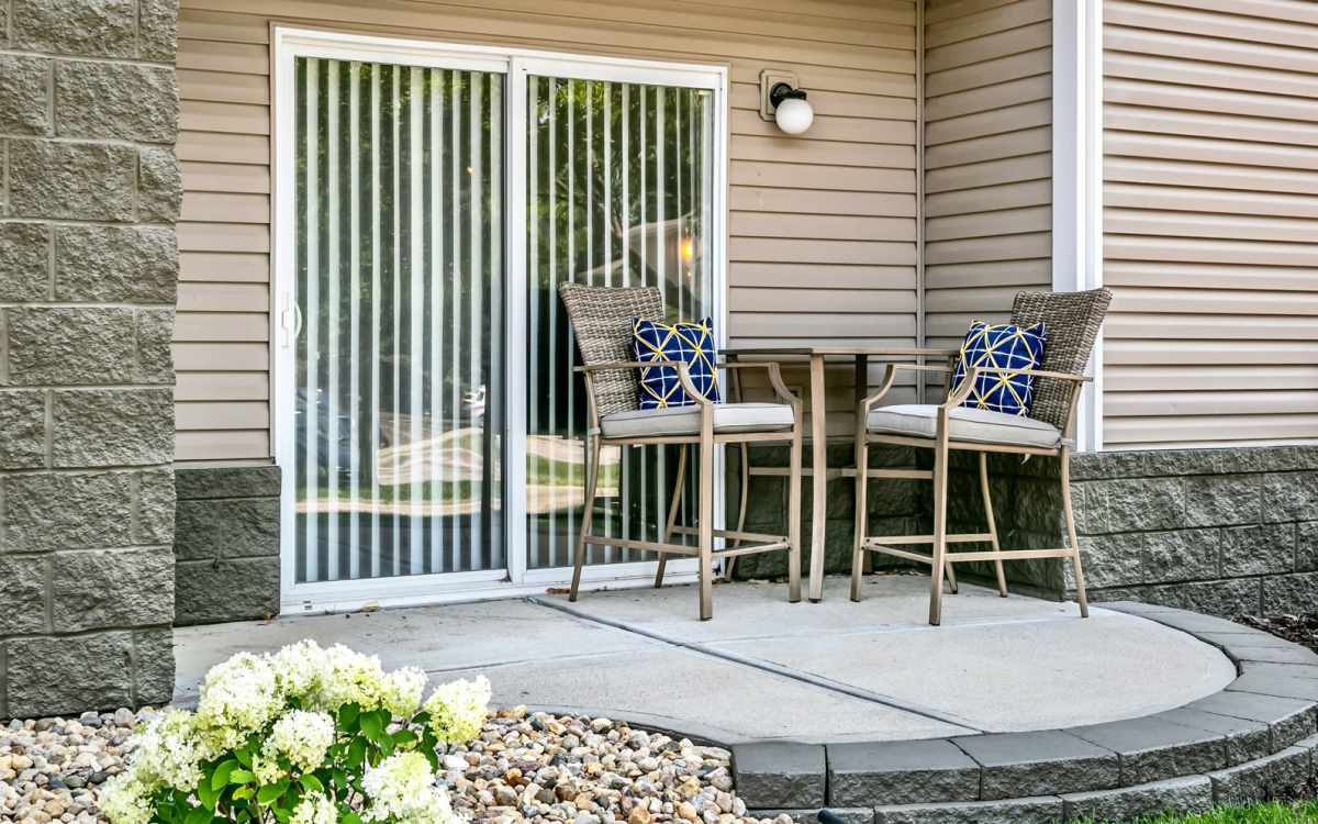 Spacious patio with seting area at The Falgrove Apartments in Omaha, Nebraska