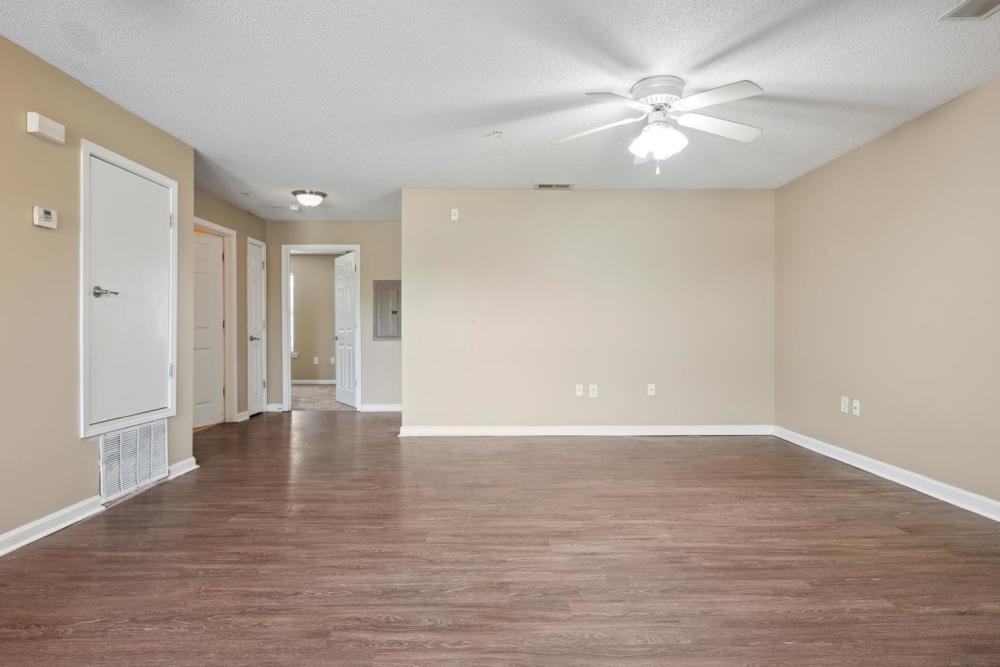 Spacious unfurnished room with wood flooring at Fellwood II in Savannah. GA