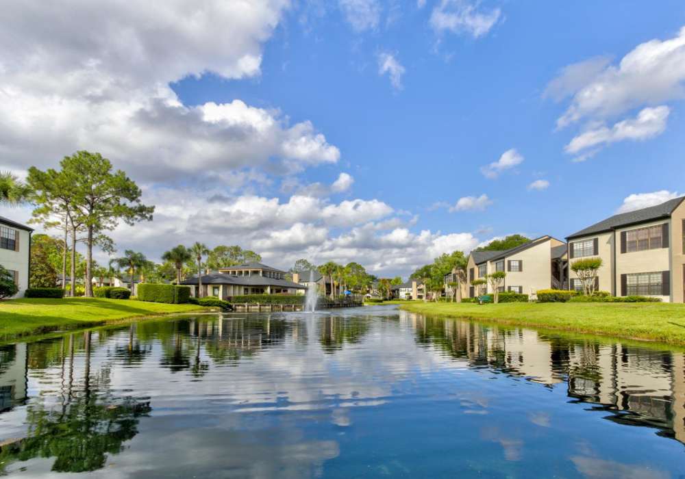Exterior building and landscape with water at Cypress Run in Orlando, Florida 
