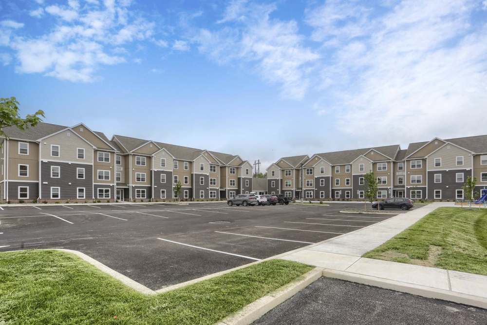 Apartment exterior showing parking area at Normandy Lofts in Shippensburg, Pennsylvania