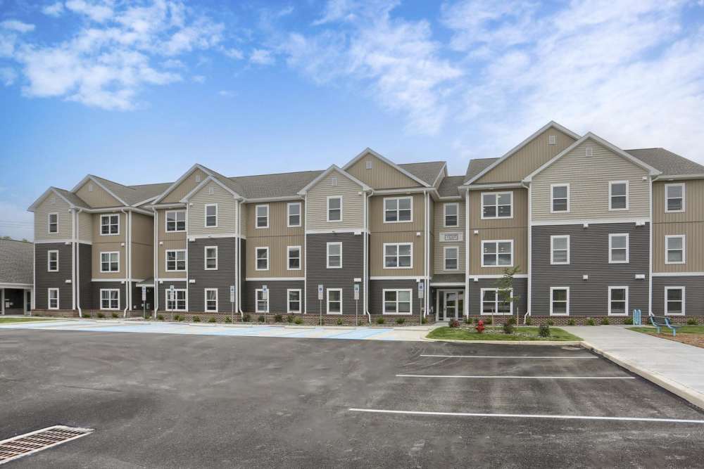 View of the apartment from outside with parking space at Normandy Lofts in Shippensburg, Pennsylvania