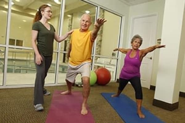 Residents doing yoga at Discovery Commons At Wildewood in California, Maryland