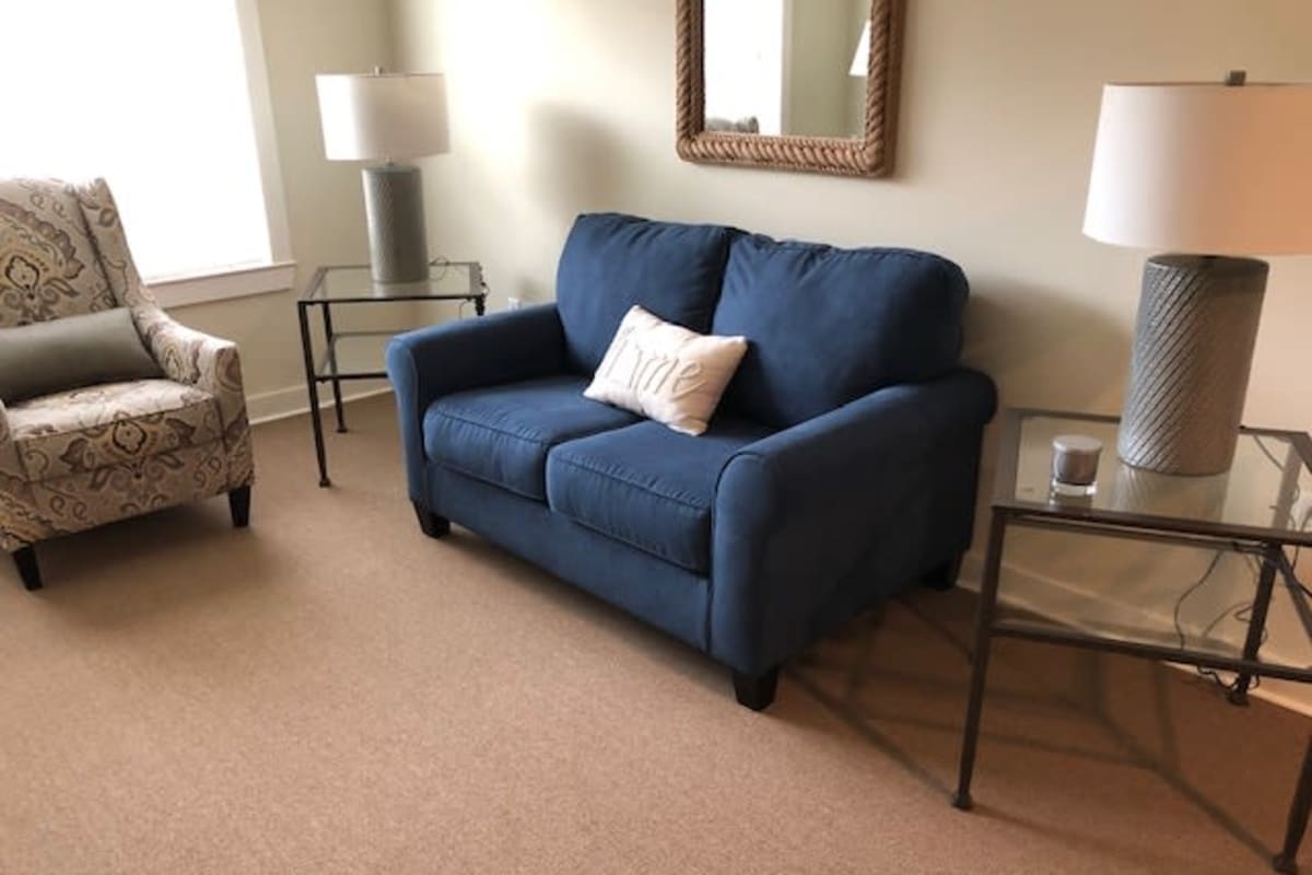 A spacious resident living room at The Claiborne at McComb in McComb, Mississippi.