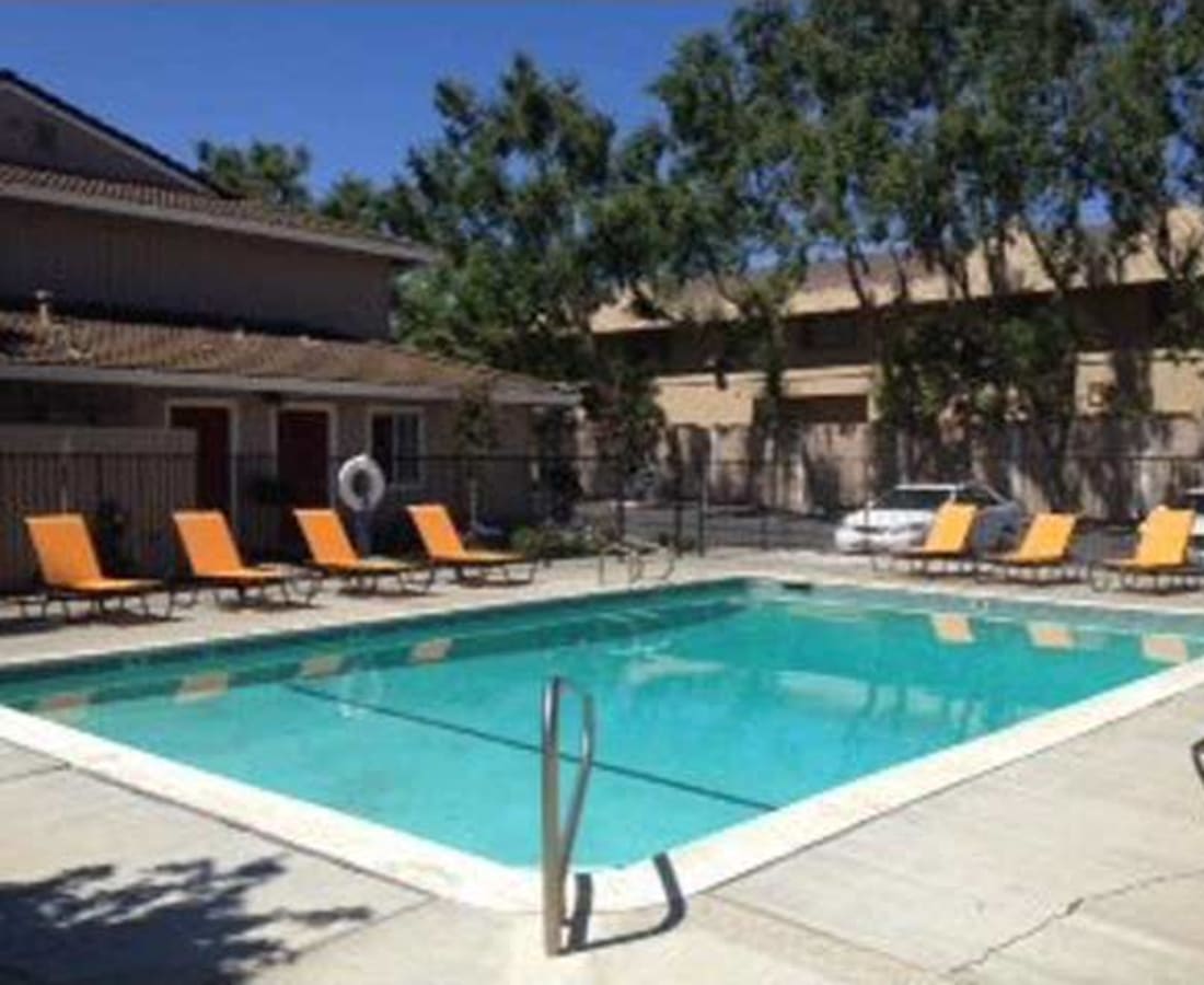 Pool with lounge chairs at The Grove at Davis in Davis, California