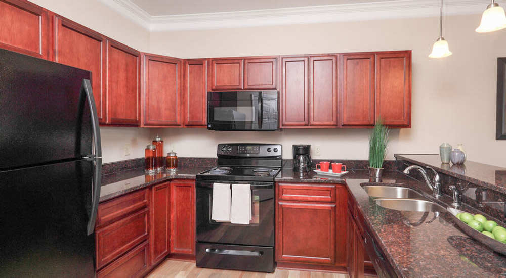Kitchen with wooden cabinets at Waverly Place in Louisa, Virginia