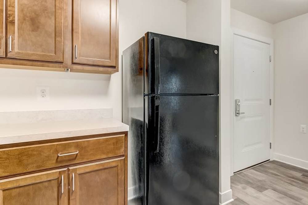 Kitchen with black refrigerator at Homes on Quaker Lane in Sandy Spring, Maryland
