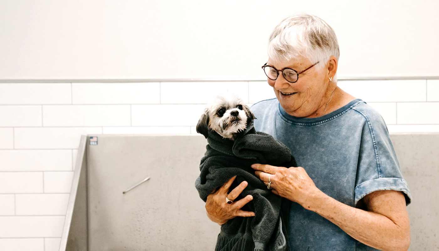 Resident with her dog at The Pillars of Hermantown in Hermantown, Minnesota