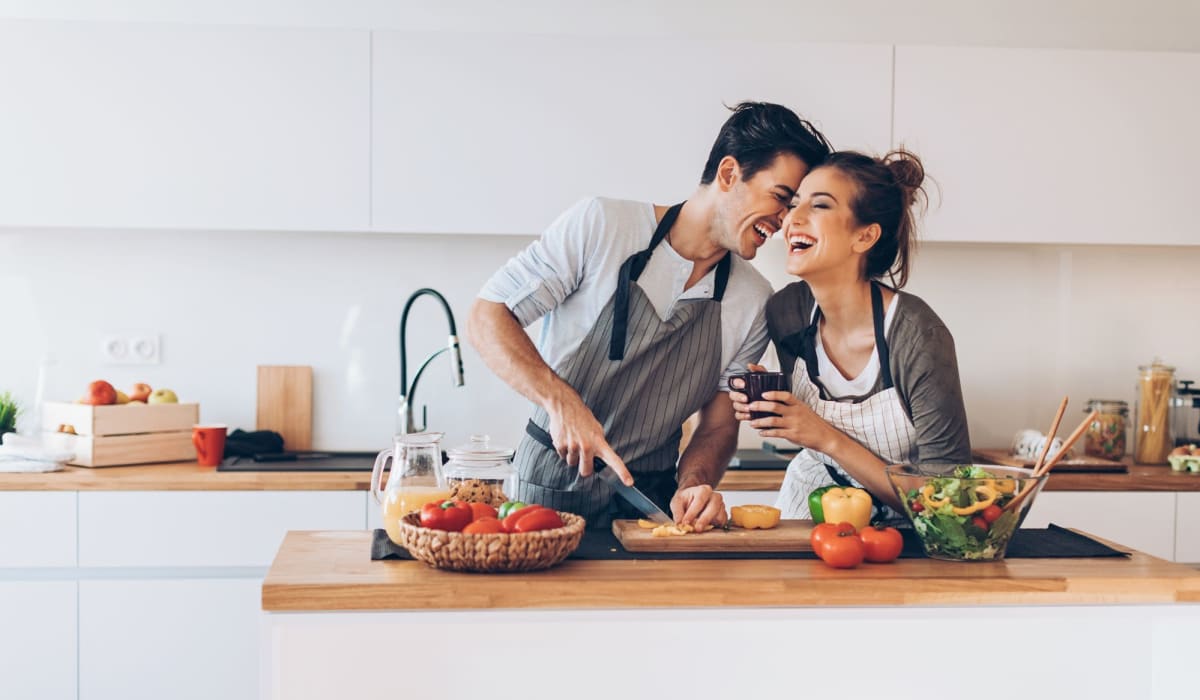 Residents prepare a meal in their chef-worthy kitchen at THE RESIDENCES AT LANDON RIDGE, San Antonio, Texas at THE RESIDENCES AT LANDON RIDGE in San Antonio, Texas