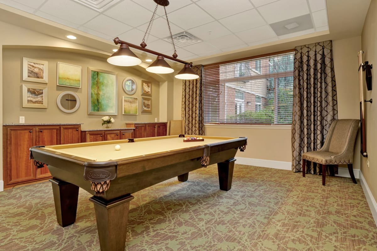 Game room with pool table at Hillcrest of Loveland in Loveland, Colorado