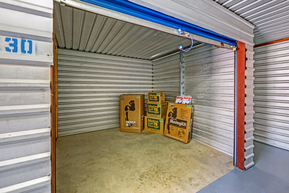 Open unit with packages at Metro Self Storage in Euless, Texas