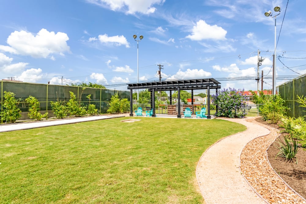 Resident lawn and seating area at EnVue Apartments in Bryan, Texas
