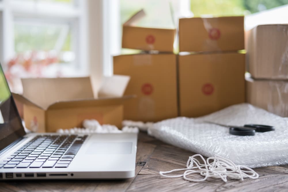 An open laptop next to packing supplies near A-American Self Storage in Santa Barbara, California