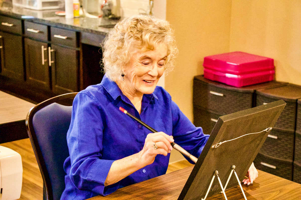 A woman practicing arts and crafts at Watermere at the Preserve in North Richland Hills, Texas.