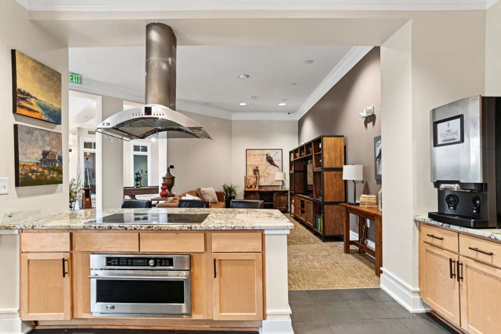 Kitchen in clubhouse with granite countertops at Fountains at Mooresville Town Square in Mooresville, North Carolina