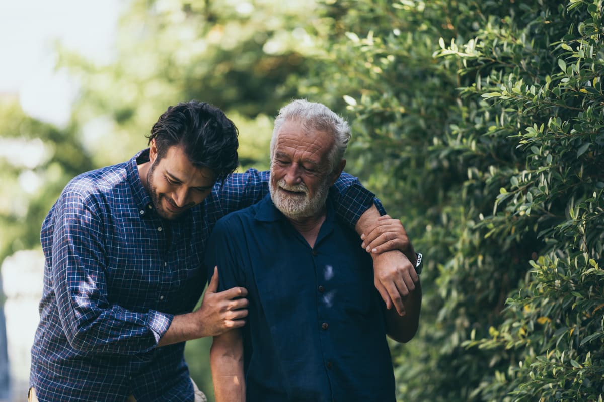 Son walking with father, a resident at a MBK Senior Living community