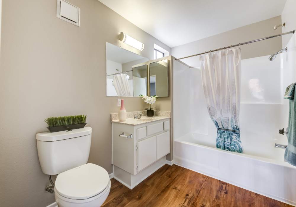Bright bathroom with bathtub and storage vanity at The Villas at Rowland Heights in Rowland Heights, California