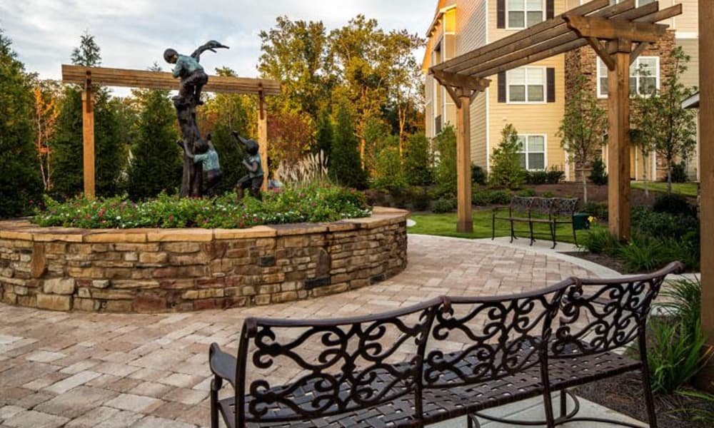 Courtyard with a statue at Enclave at Highland Ridge in Columbus, Georgia