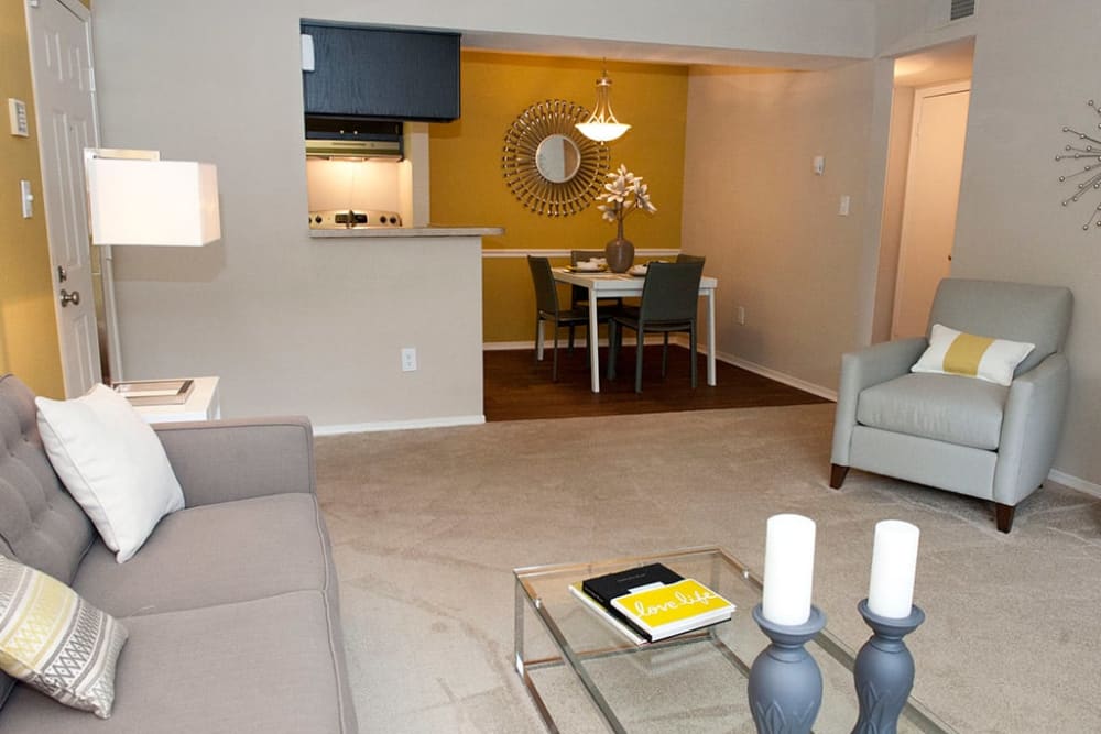 Living room and dining area in an open concept apartment home at Castlegate Collier Hills in Atlanta, Georgia