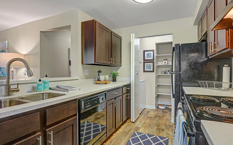 Renovated kitchen with brown cabinets at Cascade Ridge in Silverdale, Washington