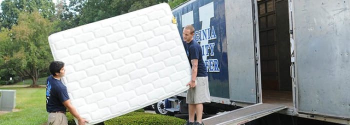 Employees loading heavy belongings into a moving truck in Salem, Virginia