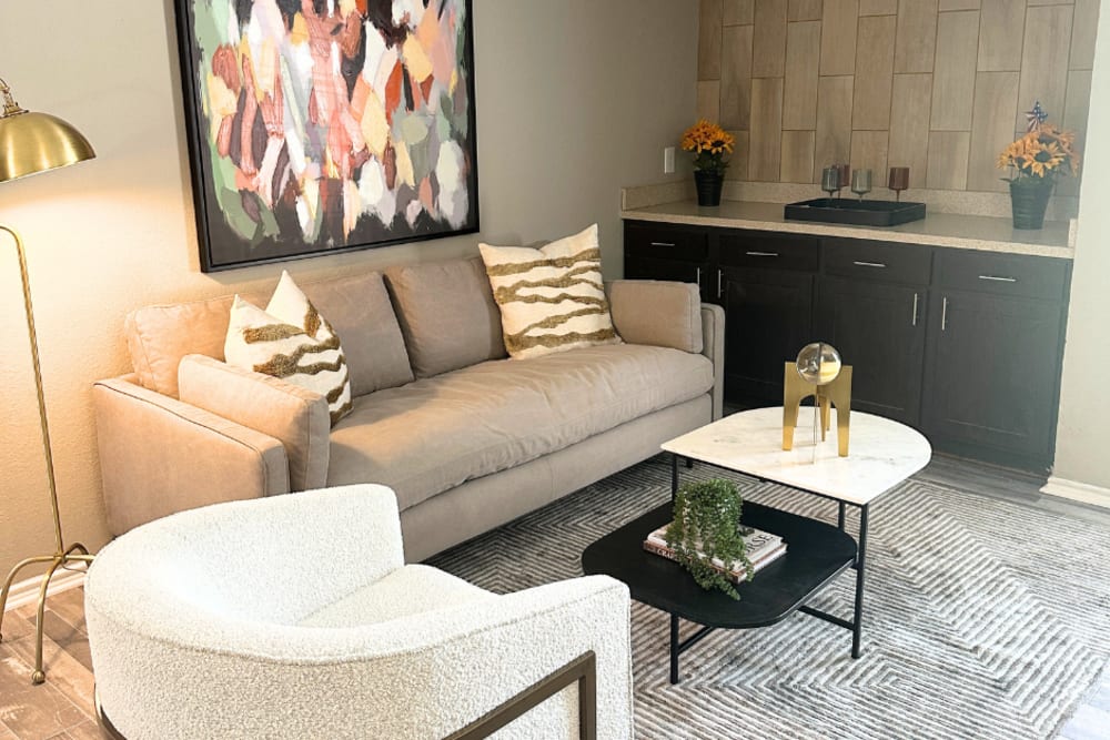 A living room with comfy couch and coffee table at Walnut Ridge in Arlington, Texas