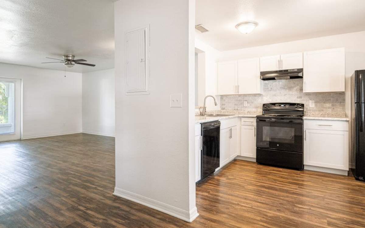 View of the kitchen and the living room at Cypress Commons in Wildwood, Florida