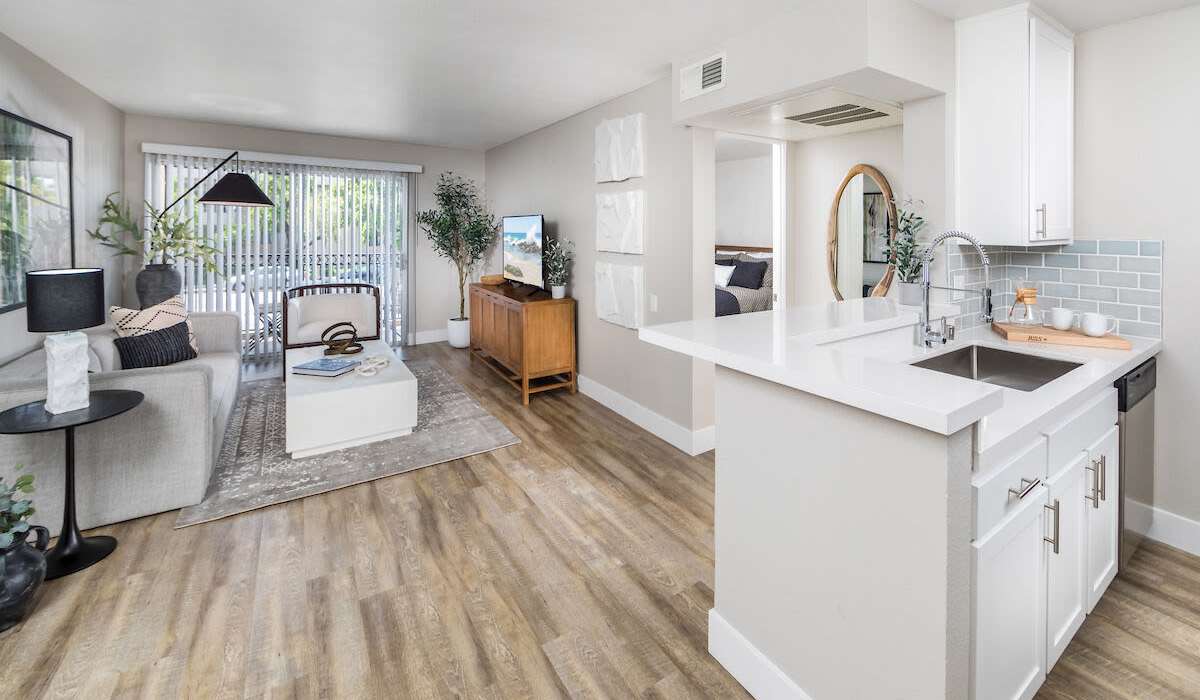 Spacious living room with connecting kitchen at Plaza at Sherman Oaks in Sherman Oaks, California