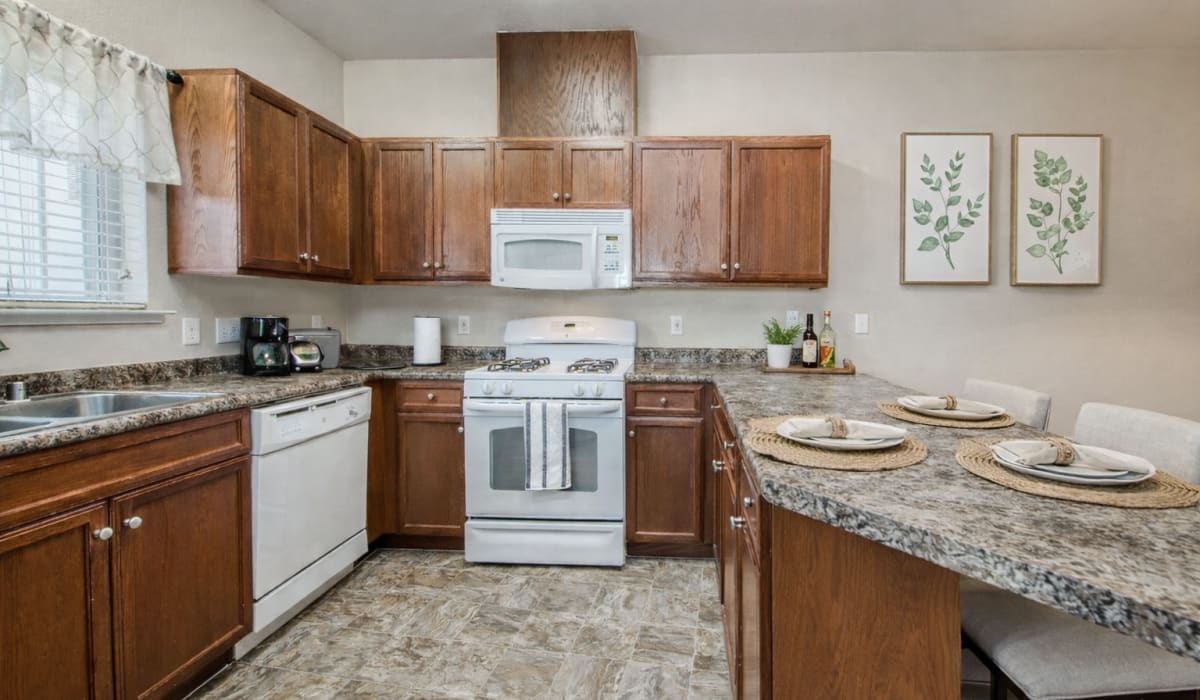 Kitchen room with white appliances at Westwood Bluffs in Fresno, California