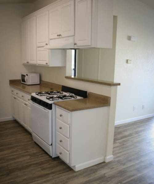 Kitchen with white cabinets at Oak Park in Turlock, California