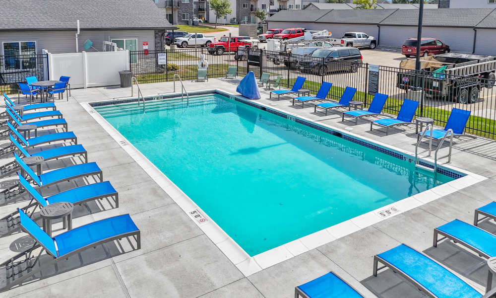 Swimming pool with lounge chairs at Sterling Pointe in Johnston, Iowa