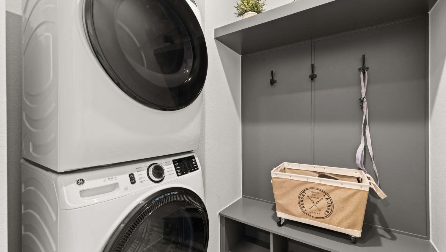 Laundry room with washer and dryer at The Lock at Flatirons in Broomfield, Colorado