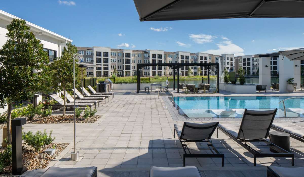 Lounge chairs by the pool at Afton Palms in Sanford, Florida