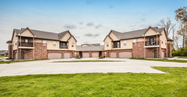 Building exterior with private garages at Cobblestone Crossings in Terre Haute, Indiana