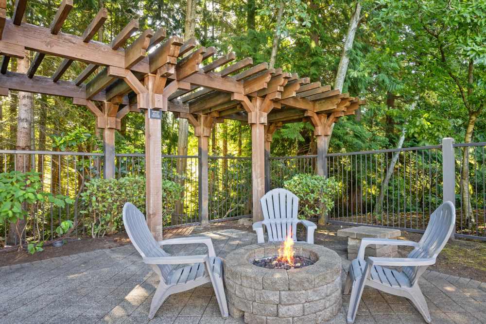 Relaxing firepit by the pool Wildreed Apartments in Everett, Washington
