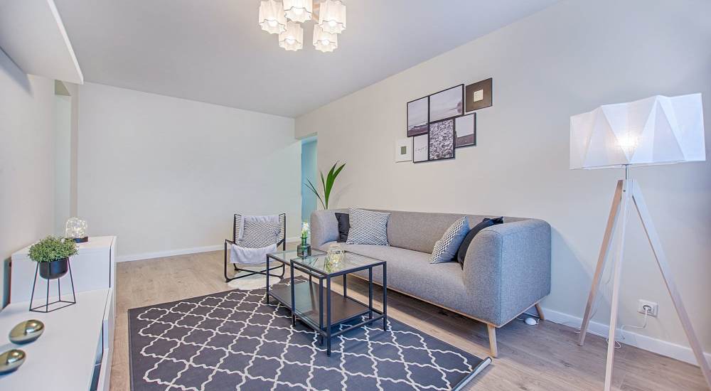 Living room with light stand at Ocean Park Villas in Santa Monica, California