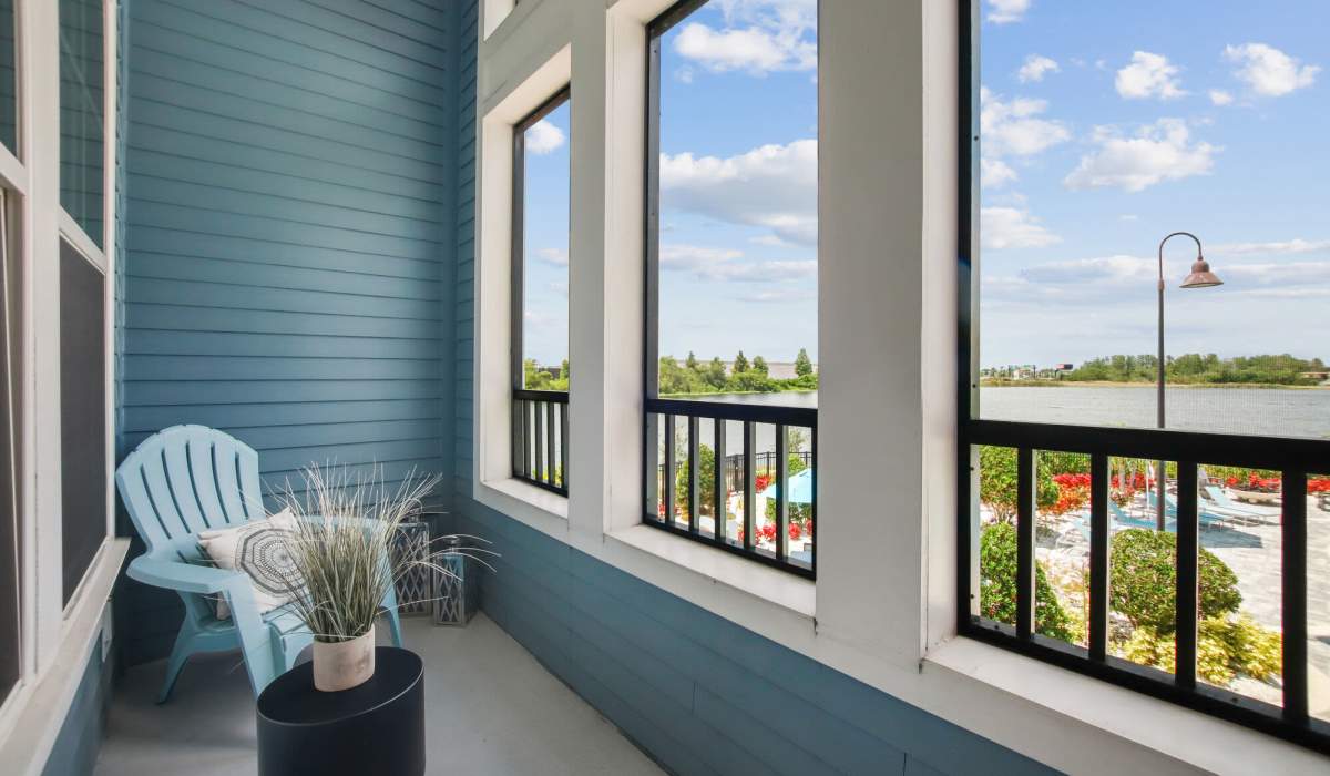 Private balcony with chair and table at The Addison on Millenia in Orlando, Florida