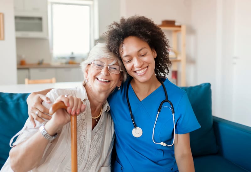 A resident and staff member hugging at Carefield Living.