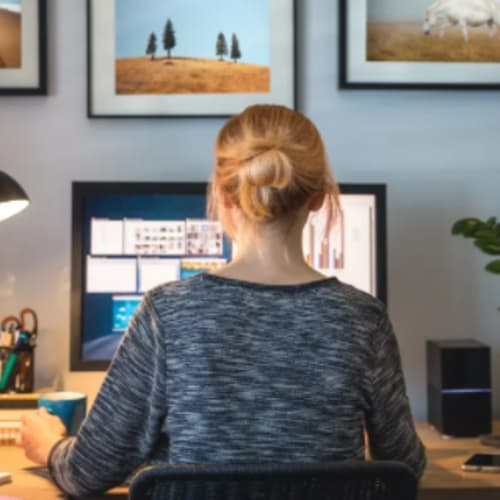 Resident working on her computer at The 805W Lofts in Richmond, Virginia