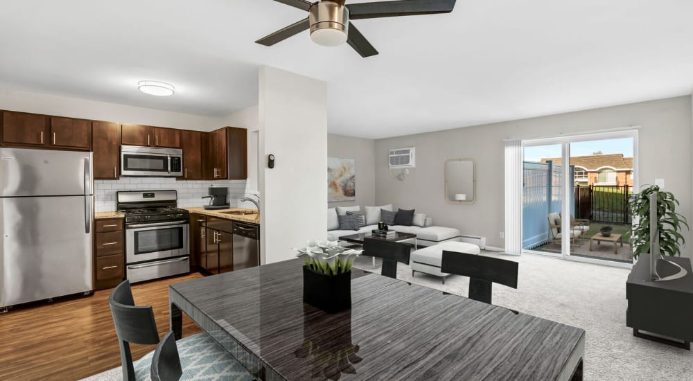 An apartment dining room, kitchen and living room at Huntington Apartments in Naperville, Illinois