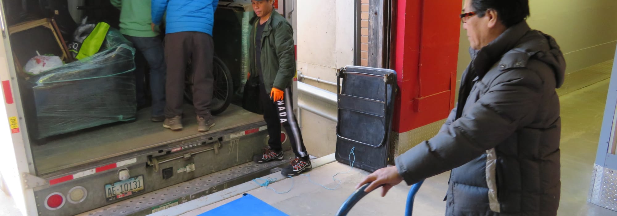 customer with cart and truck Centron Self Storage in North York, Ontario
